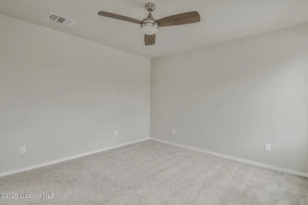 en empty room with a fan