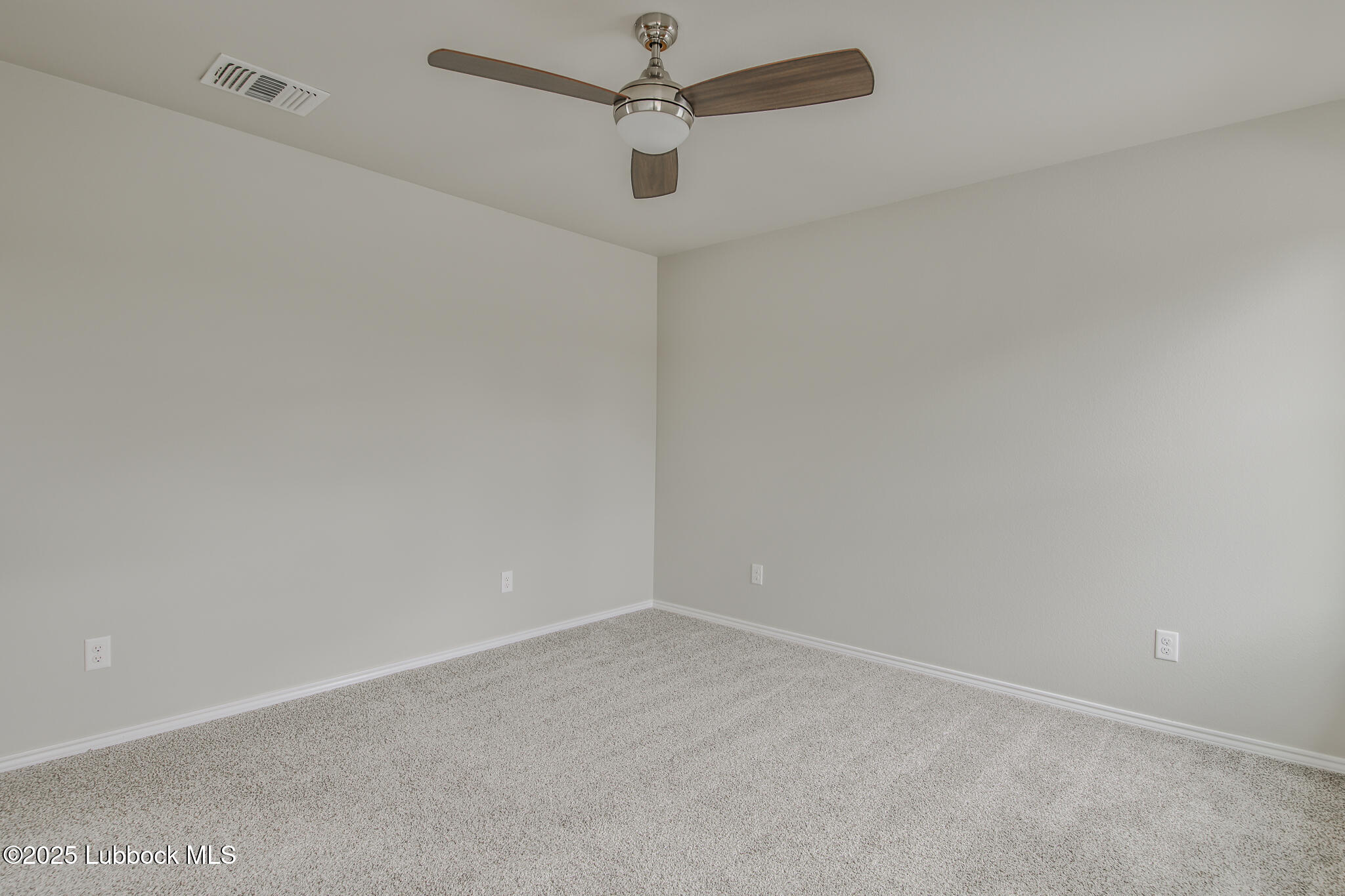 3119 74th Street Lubbock, TX 79423 - Photo 36 of 36 en empty room with a fan