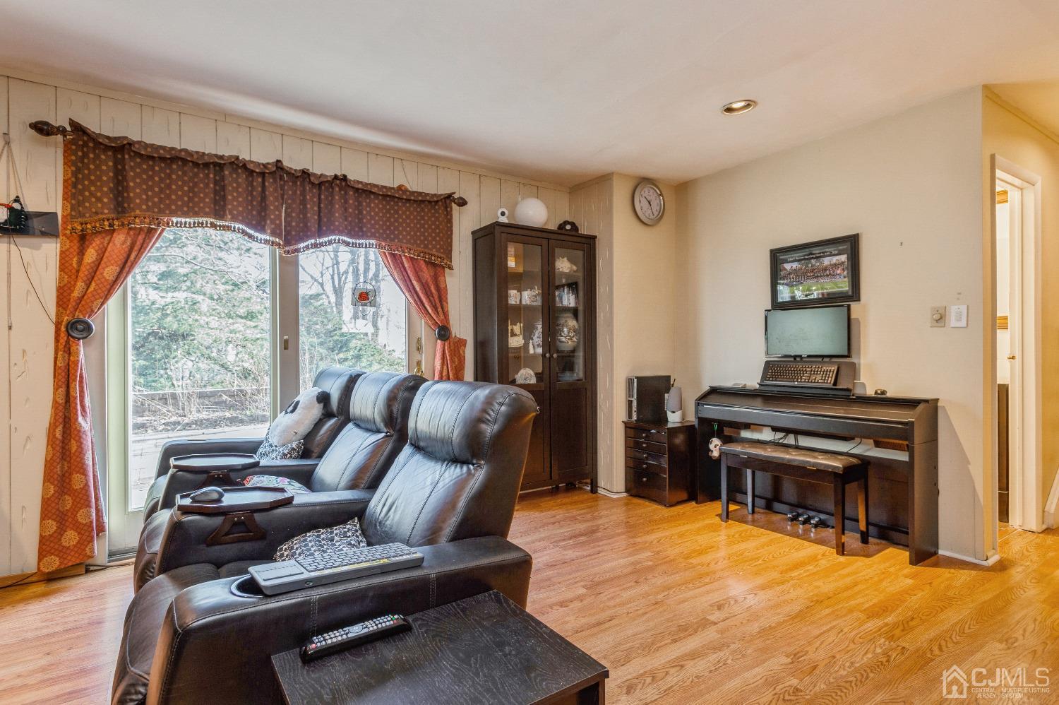 2 Sherwood Road Edison, NJ 08820 - Photo 15 of 26 a living room with furniture and a piano