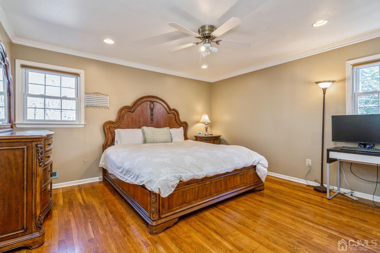 2 Sherwood Road Edison, NJ 08820 - Photo 16 of 26 a bedroom with a bed and a flat tv screen on dresser