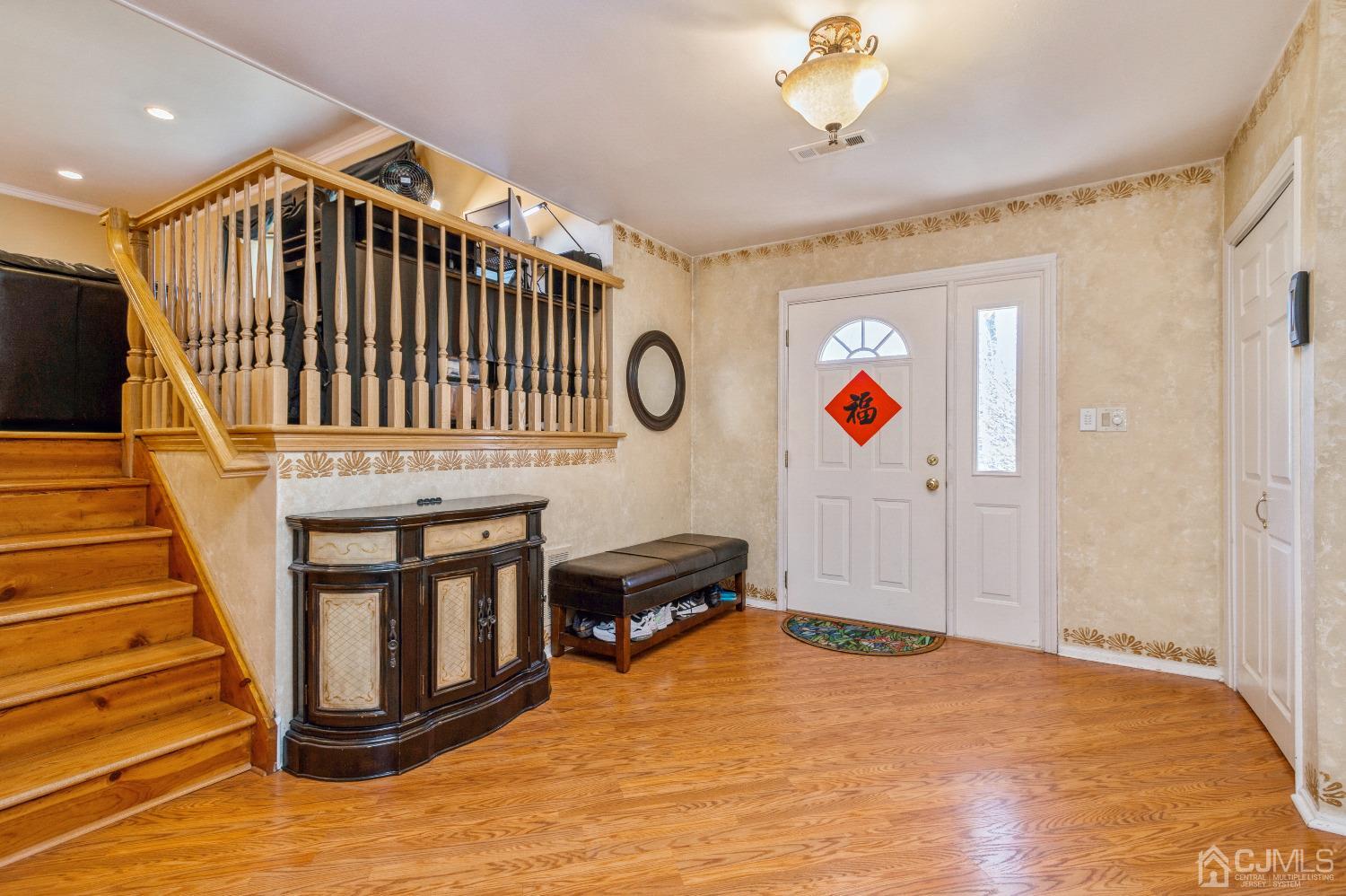 2 Sherwood Road Edison, NJ 08820 - Photo 2 of 26 a view of entryway hall and hall with wooden floor