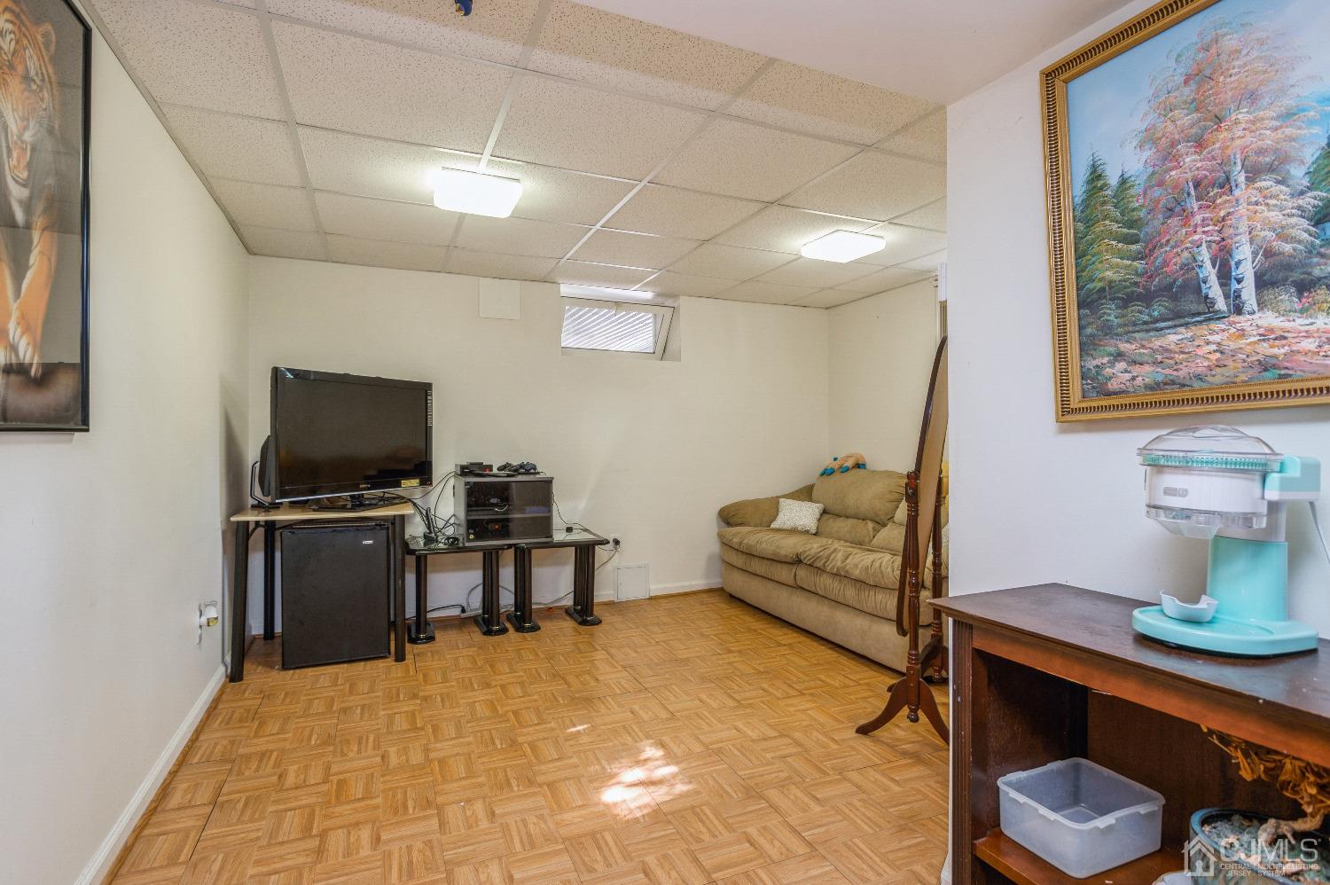 2 Sherwood Road Edison, NJ 08820 - Photo 22 of 26 a living room with furniture and a flat screen tv