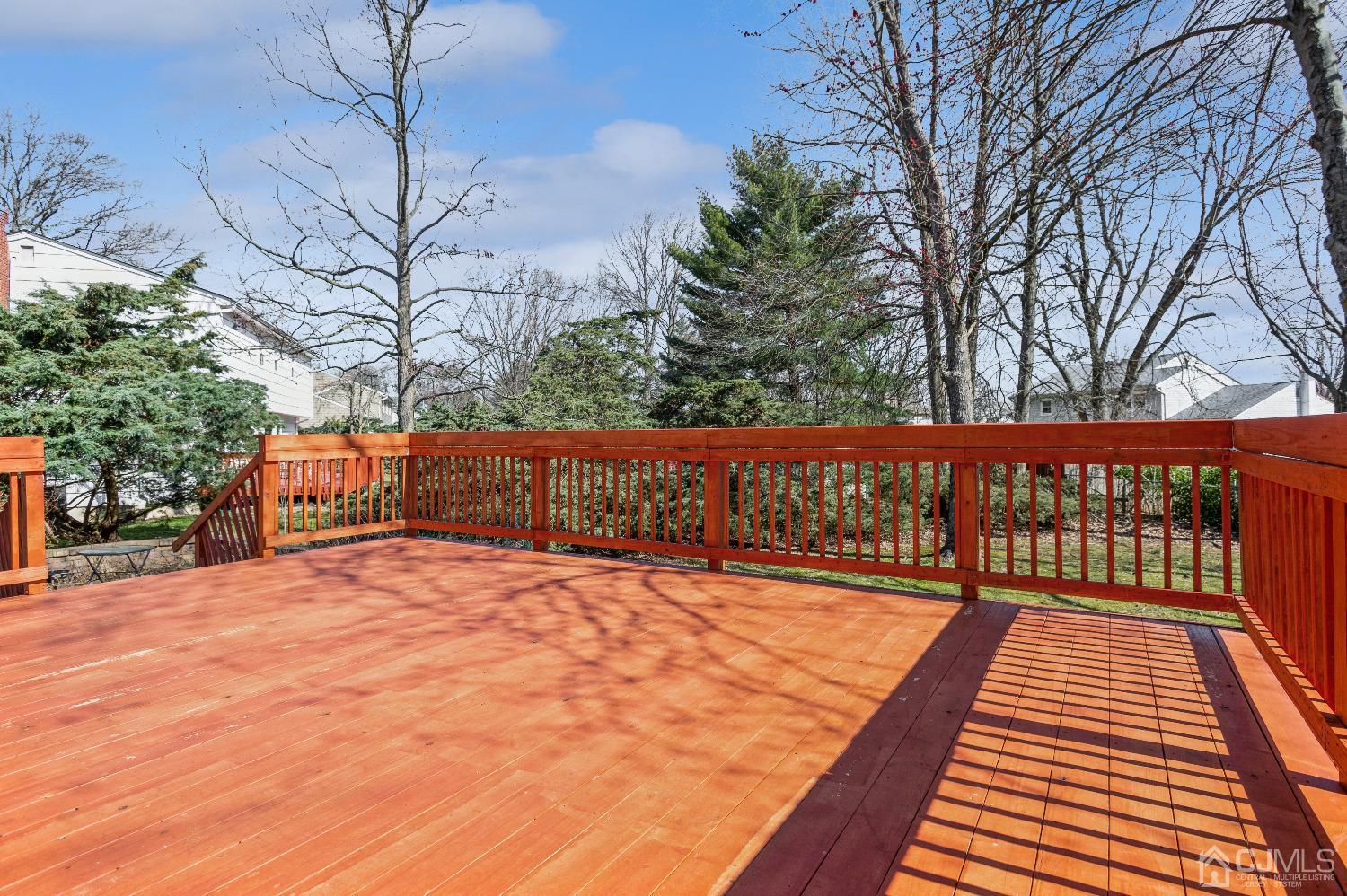 2 Sherwood Road Edison, NJ 08820 - Photo 24 of 26 a view of a backyard with wooden fence and trees
