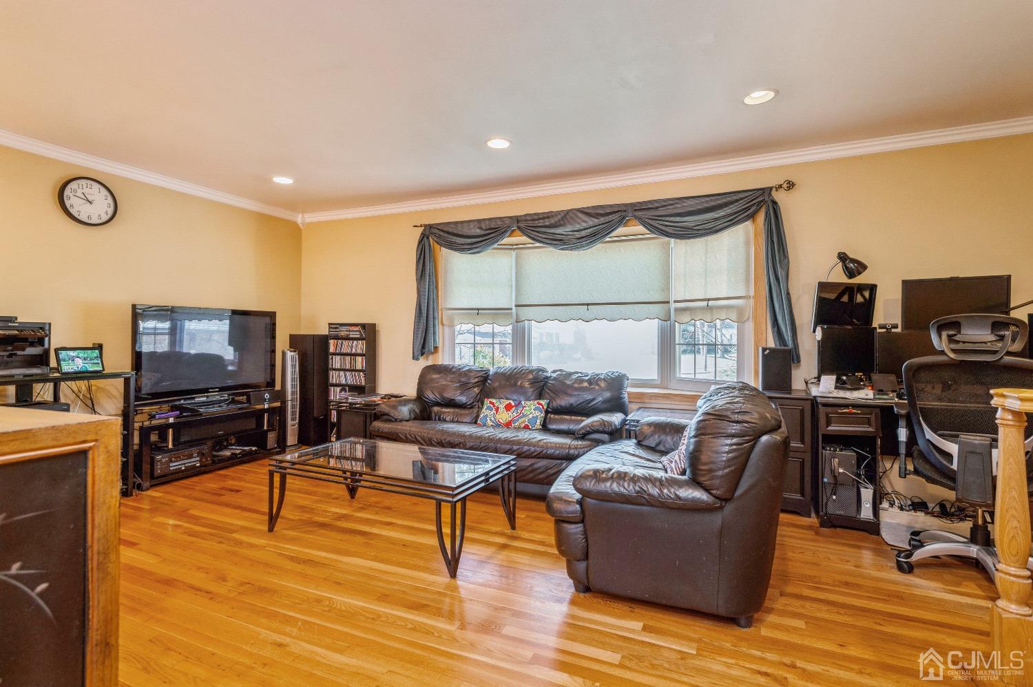 2 Sherwood Road Edison, NJ 08820 - Photo 7 of 26 a living room with furniture and a flat screen tv
