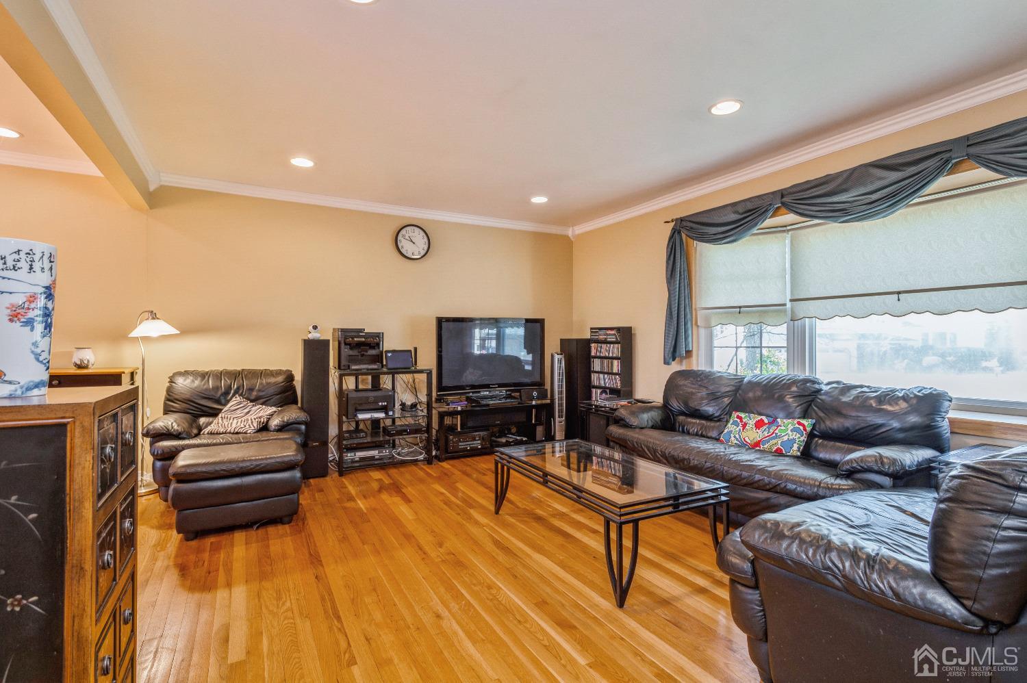 2 Sherwood Road Edison, NJ 08820 - Photo 8 of 26 a living room with furniture and a flat screen tv