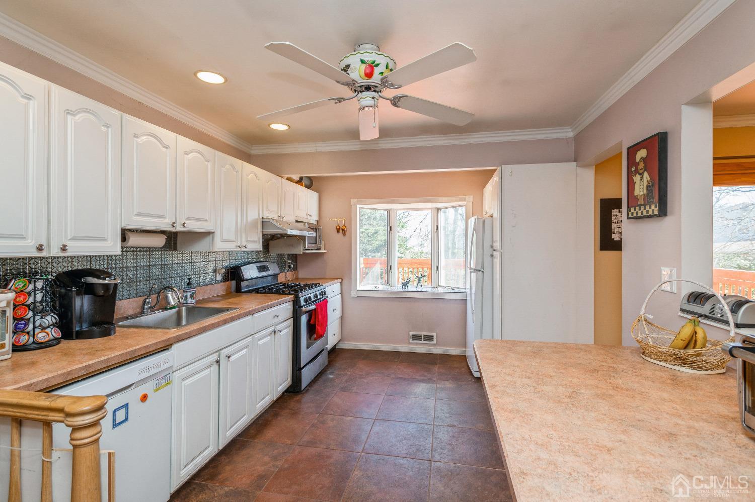 2 Sherwood Road Edison, NJ 08820 - Photo 9 of 26 a kitchen that has a lot of cabinets in it and appliances