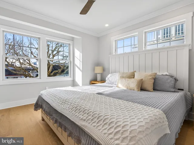 a bathroom with a sink toilet a mirror and shower