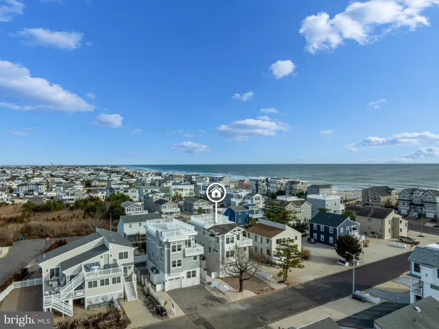 a living room with furniture a window and a fireplace