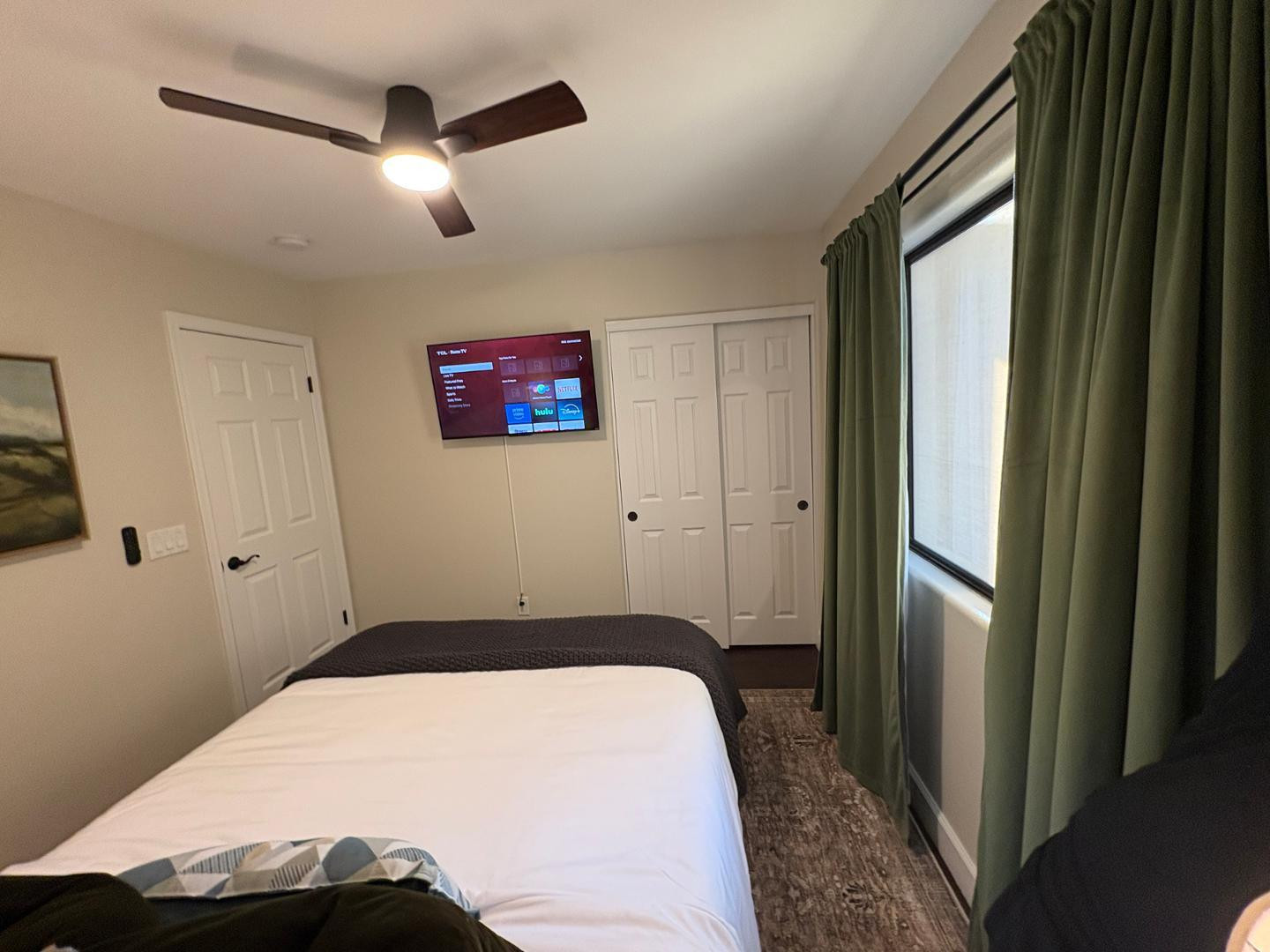 20619 North 16th Way Phoenix, AZ 85024 - Photo 43 of 50 a bedroom with a large bed and a chandelier