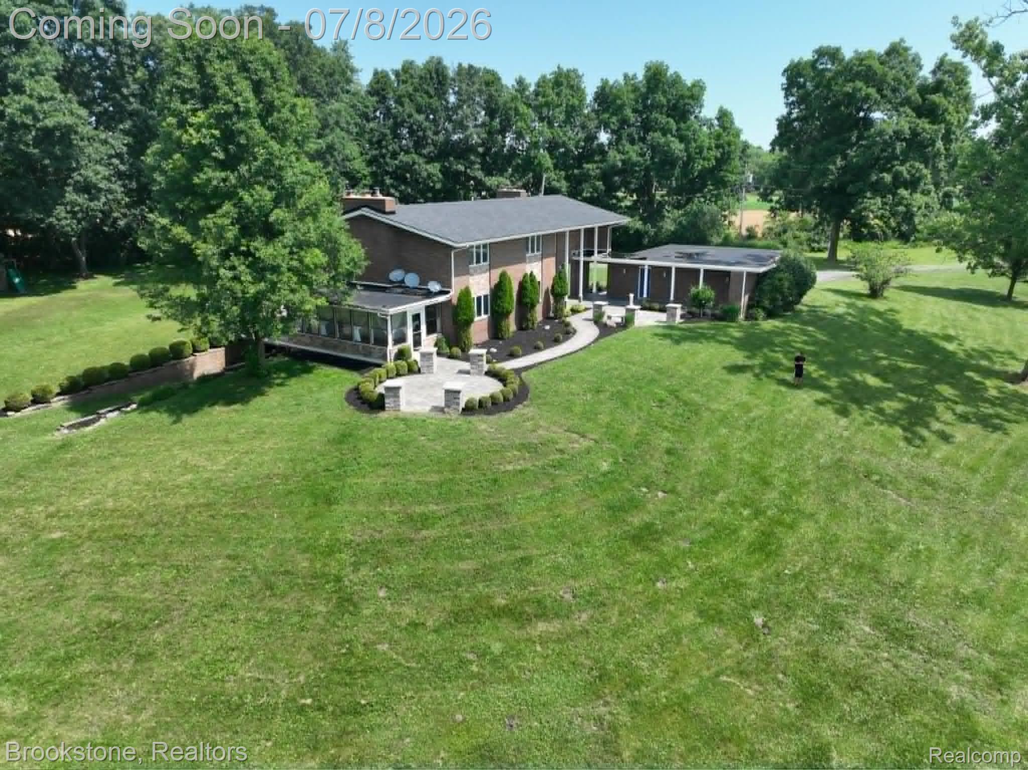 4140 South Henderson Road Davison, MI 48423 - Photo 7 of 98 Brick exterior residence with a dark shingle roof