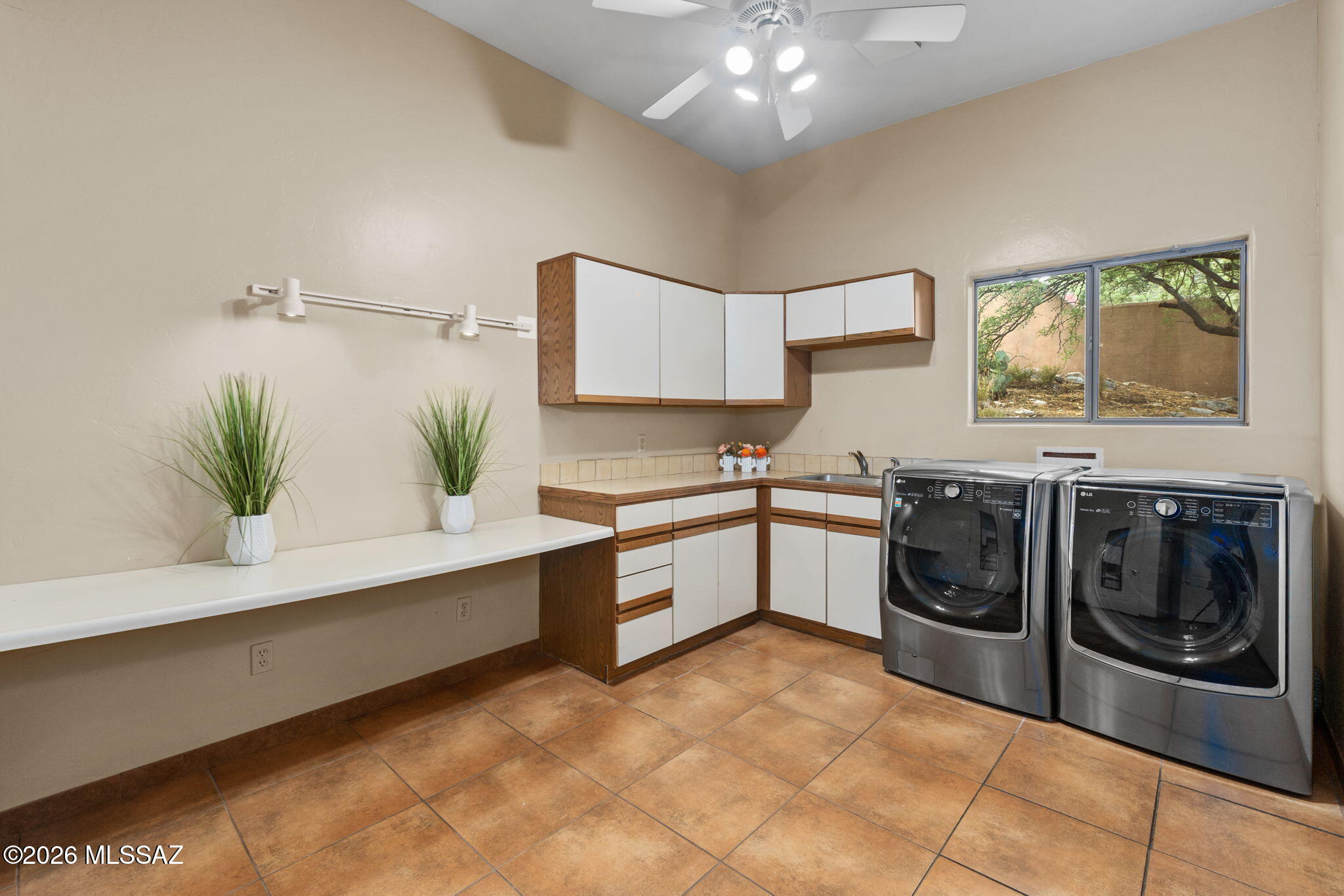4612 North Rockcliff Road Tucson, AZ 85750 - Photo 26 of 28 Lots of counterspace, sink and built in ironing board for convenience.