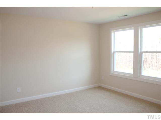2800 Bending Tree Court, Unit LT8 Raleigh, NC 27613 - Photo 15 of 25 an empty room with a window