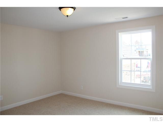 2800 Bending Tree Court, Unit LT8 Raleigh, NC 27613 - Photo 19 of 25 an empty room with a window