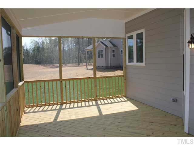 2800 Bending Tree Court, Unit LT8 Raleigh, NC 27613 - Photo 22 of 25 a view of a porch with a backyard