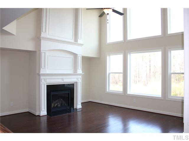 2800 Bending Tree Court, Unit LT8 Raleigh, NC 27613 - Photo 6 of 25 a view of an empty room with a window and fireplace