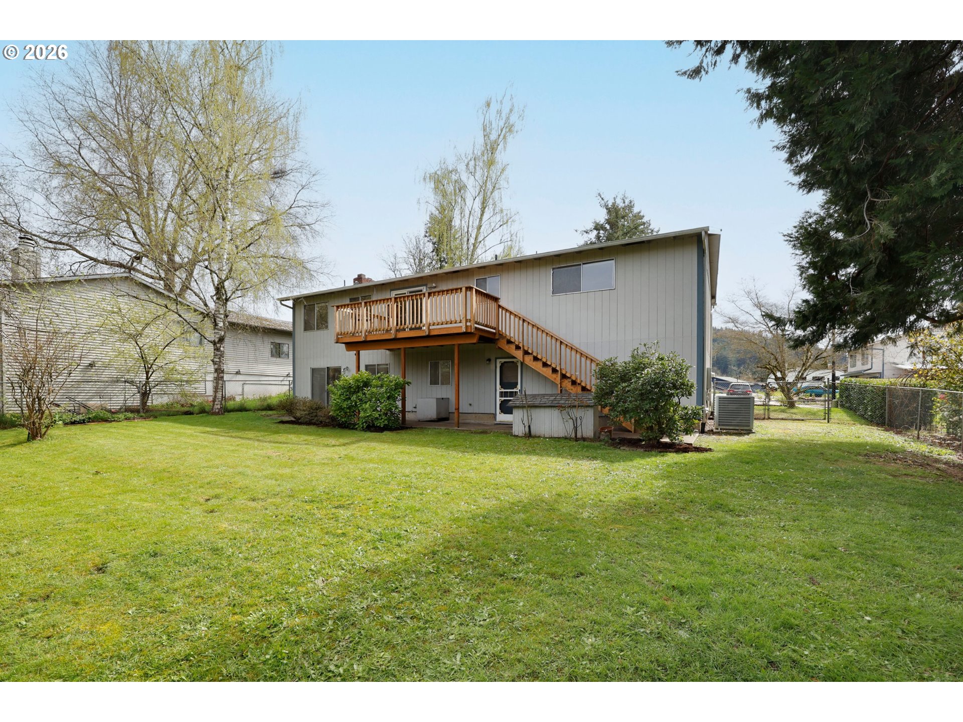 16285 Southwest Rosa Road Beaverton, OR 97007 - Photo 19 of 20 a view of a big house with a big yard and large trees