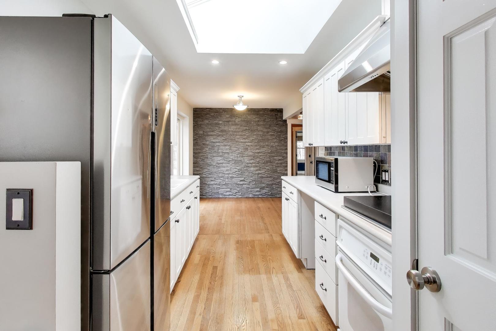 7 Alton Road Prospect Heights, IL 60070 - Photo 13 of 44 a kitchen with stainless steel appliances granite countertop a refrigerator and a stove
