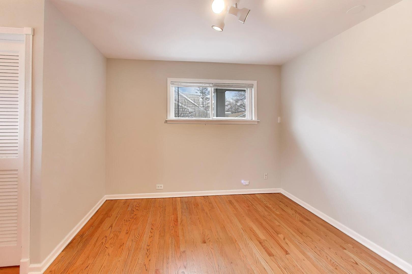 7 Alton Road Prospect Heights, IL 60070 - Photo 16 of 44 an empty room with wooden floor and windows
