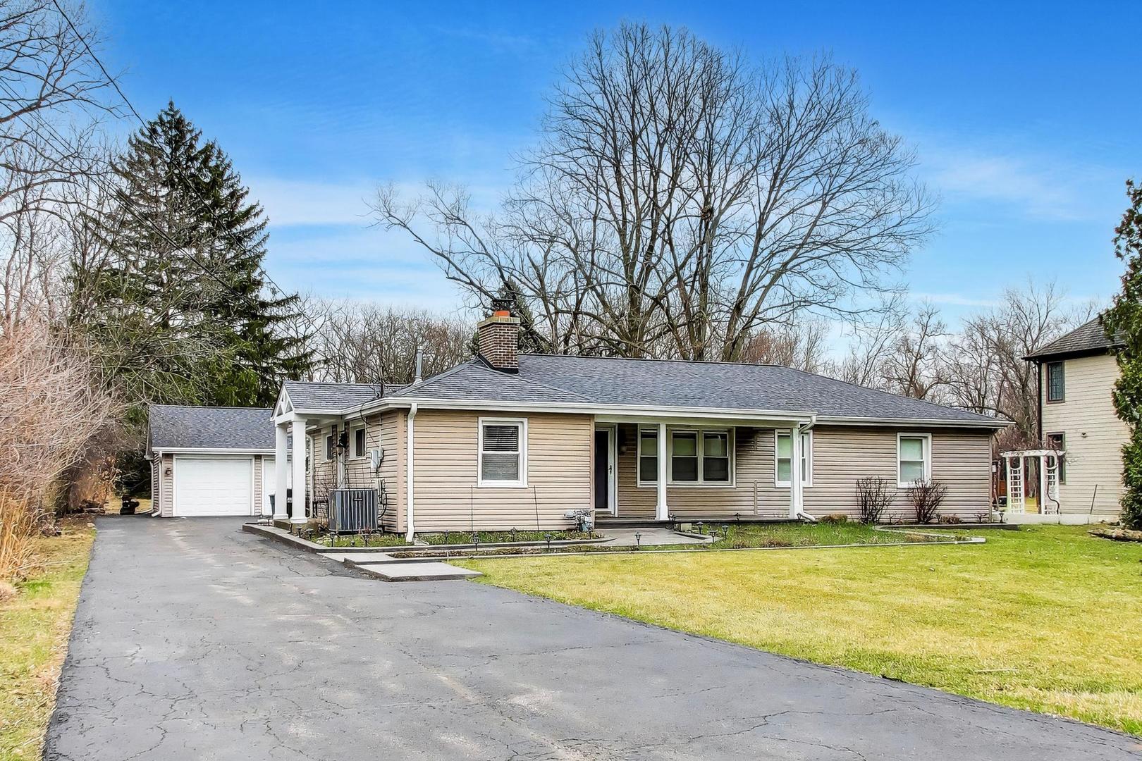 7 Alton Road Prospect Heights, IL 60070 - Photo 2 of 44 a view of a yard with a house and a large tree