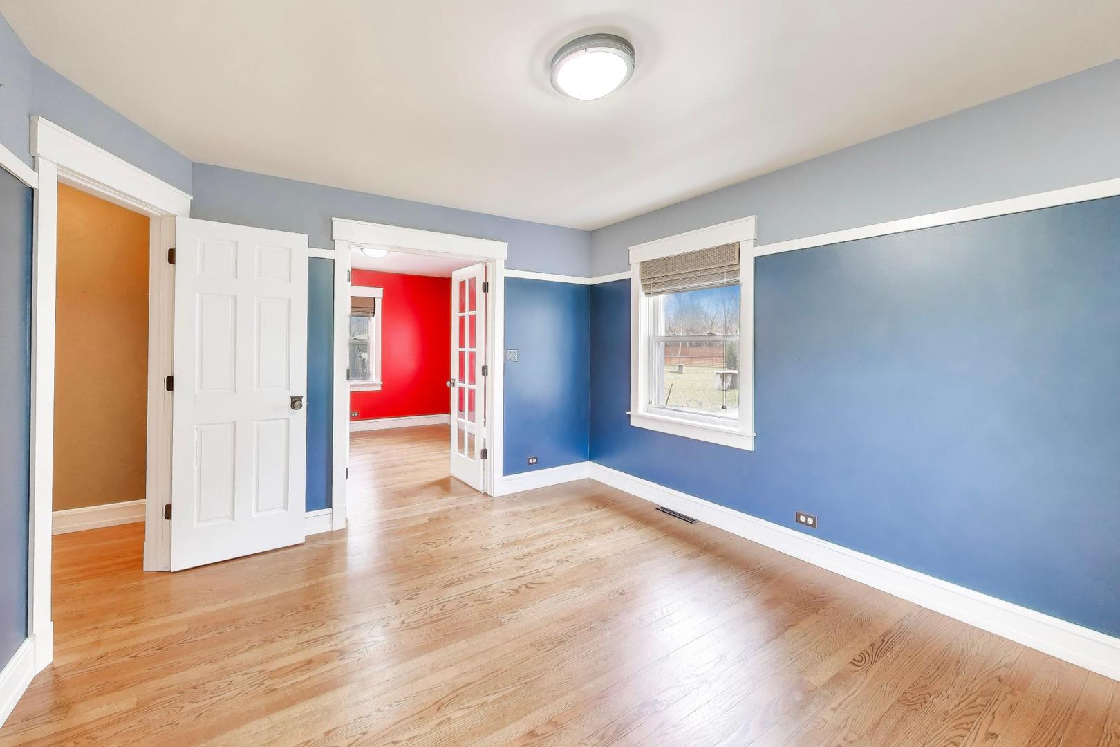 7 Alton Road Prospect Heights, IL 60070 - Photo 21 of 44 wooden floor in an empty room with a window