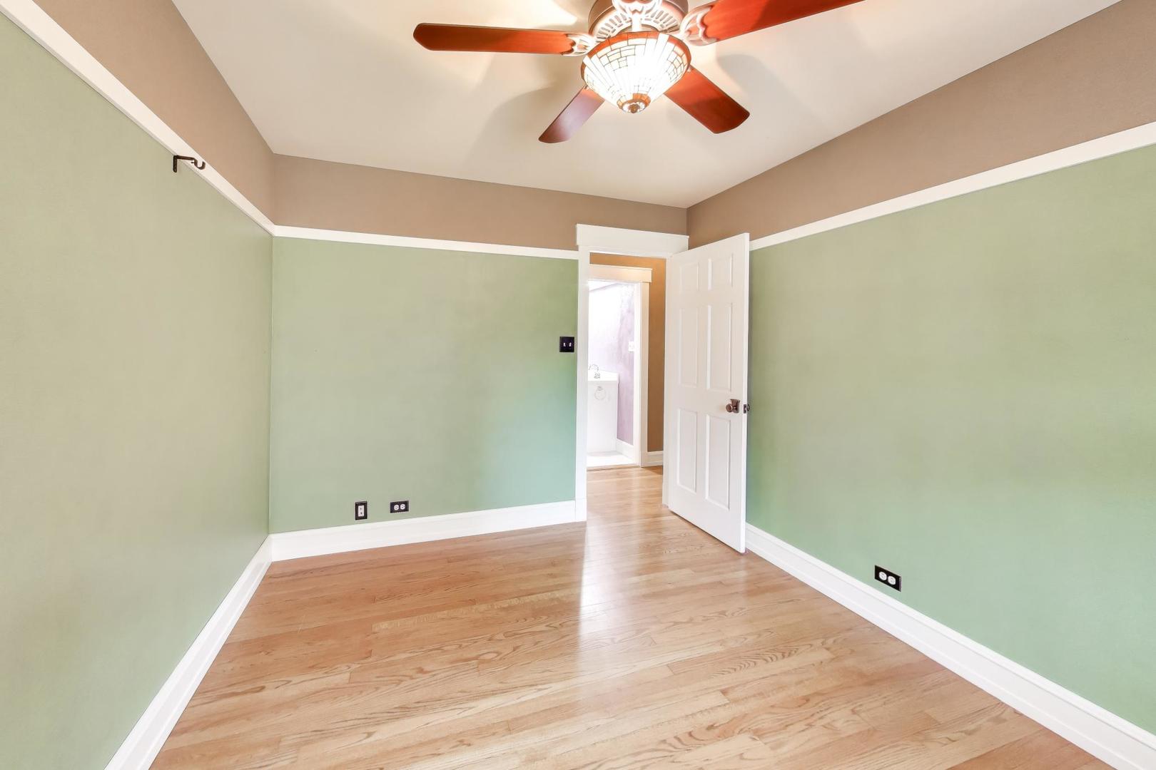 7 Alton Road Prospect Heights, IL 60070 - Photo 27 of 44 a view of an empty room with wooden floor