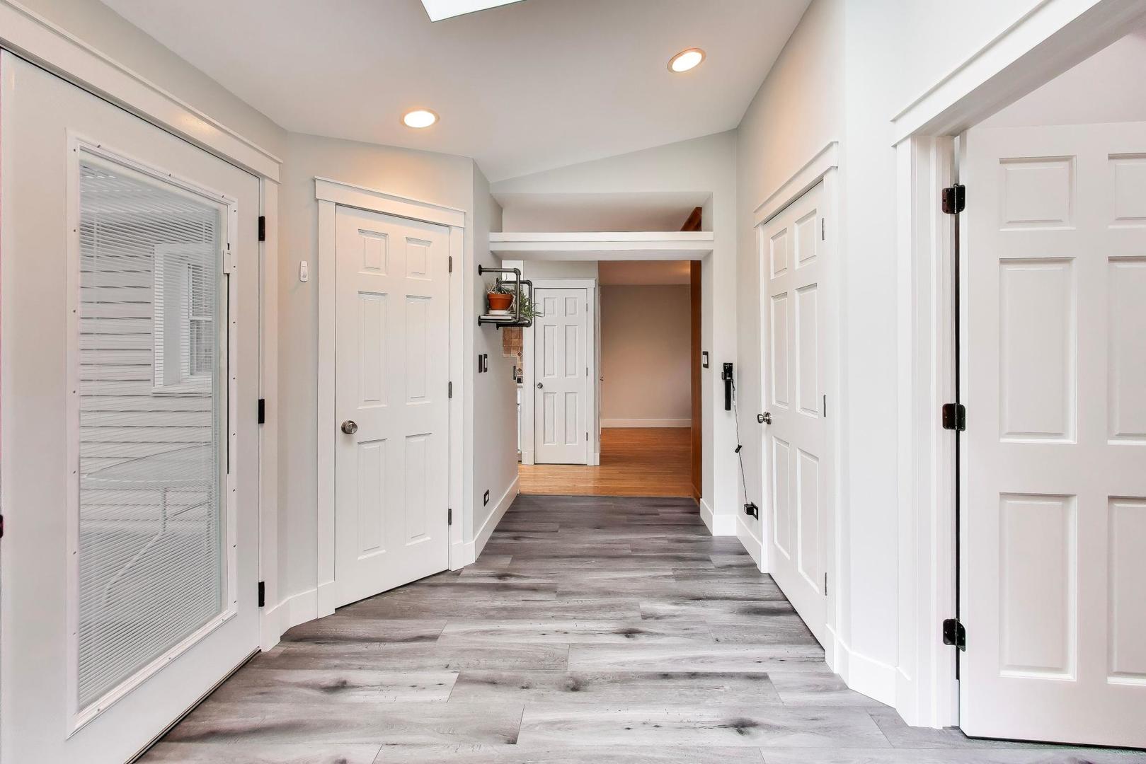 7 Alton Road Prospect Heights, IL 60070 - Photo 30 of 44 a view of a hallway with wooden floor and staircase