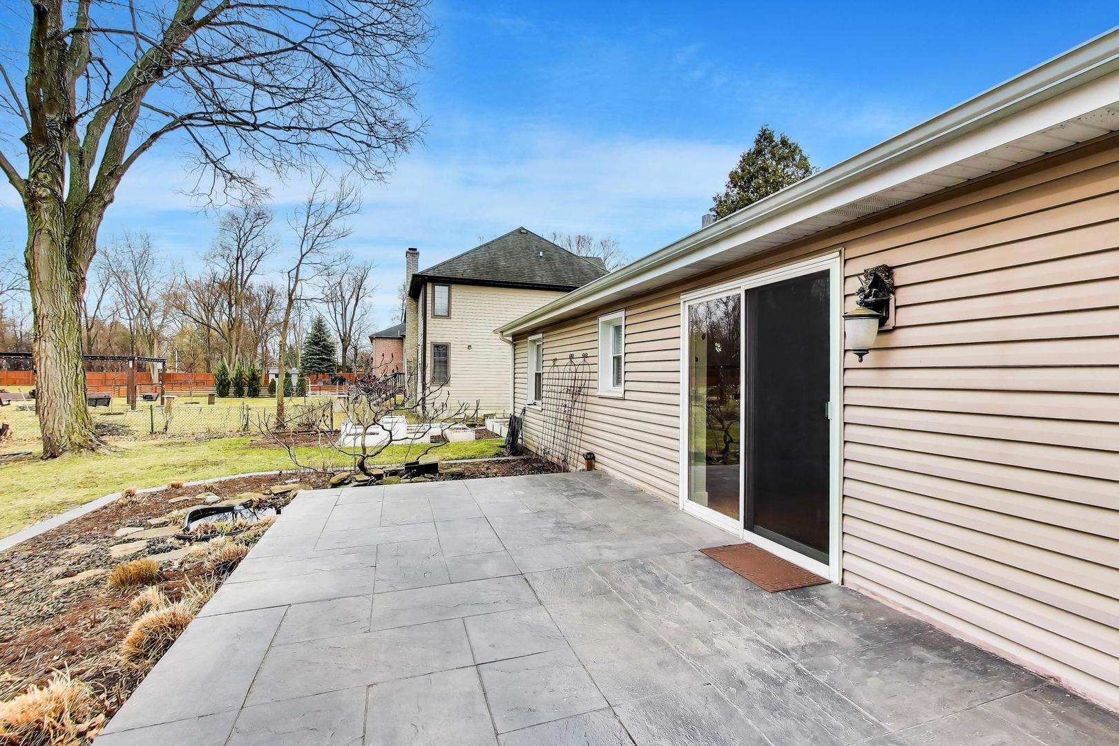 7 Alton Road Prospect Heights, IL 60070 - Photo 33 of 44 a view of a house with backyard and sitting area