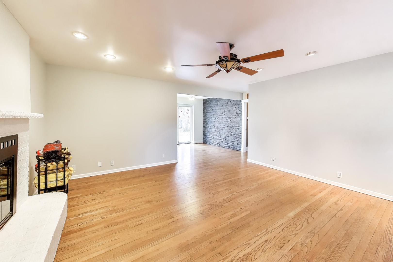 7 Alton Road Prospect Heights, IL 60070 - Photo 6 of 44 a view of a room with wooden floor and ceiling fan