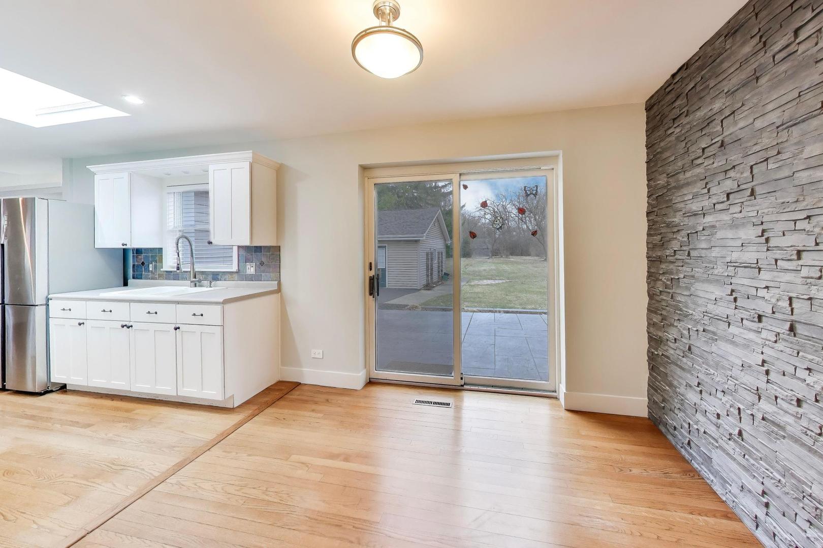 7 Alton Road Prospect Heights, IL 60070 - Photo 8 of 44 a view of a kitchen with a sink and dishwasher with wooden floor