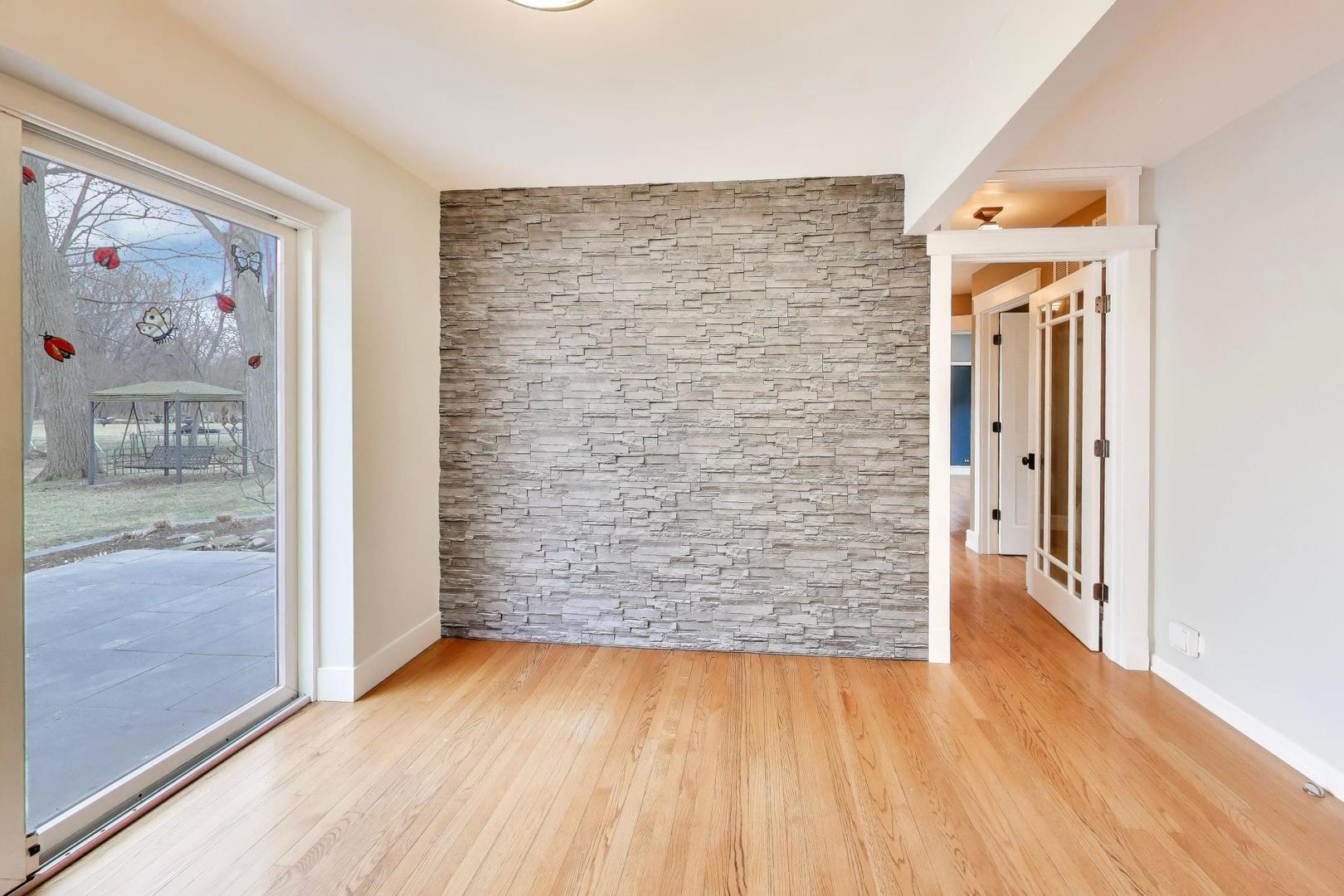 7 Alton Road Prospect Heights, IL 60070 - Photo 9 of 44 a view of a hallway with wooden floor and door