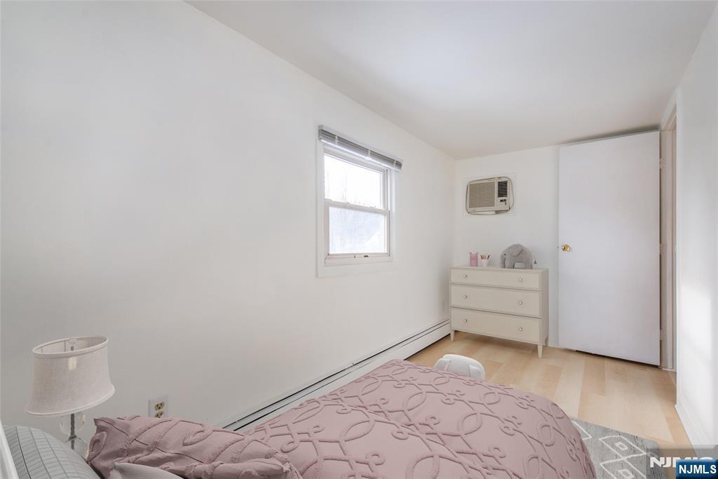 116 Edison Street Clifton, NJ 07013 - Photo 15 of 19 a bedroom with a bed and a window