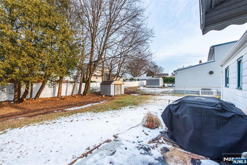 116 Edison Street Clifton, NJ 07013 - Photo 18 of 19 a view of a house with snow on the road