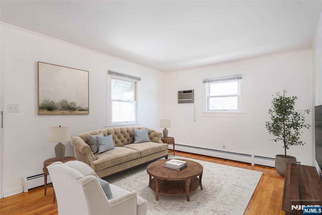 116 Edison Street Clifton, NJ 07013 - Photo 2 of 19 a living room with furniture and a potted plant