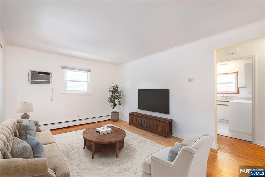116 Edison Street Clifton, NJ 07013 - Photo 3 of 19 a living room with furniture and a flat screen tv