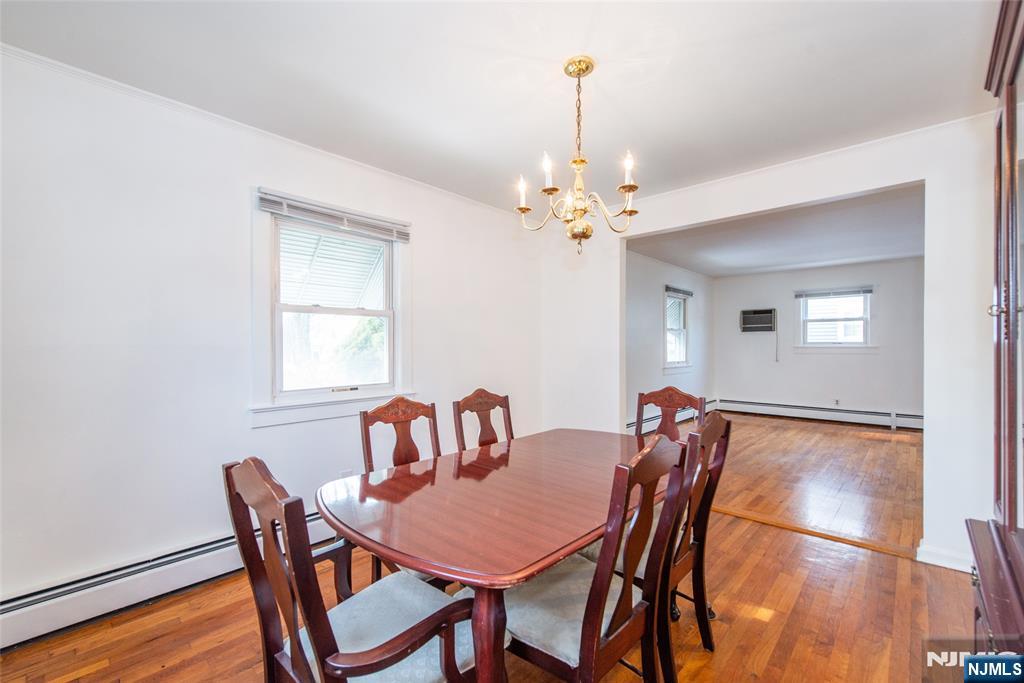 116 Edison Street Clifton, NJ 07013 - Photo 7 of 19 a view of a dining room with furniture and wooden floor
