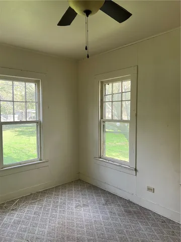 an empty room with windows