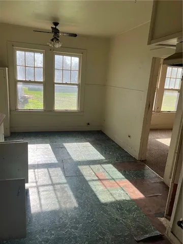 a view of empty room with windows