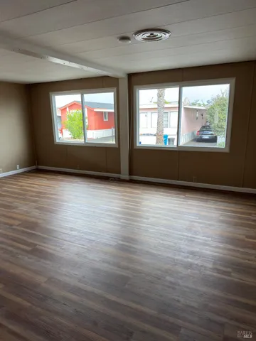 a view of an empty room and a window