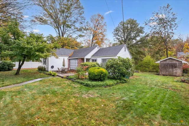 a view of a house with a back yard