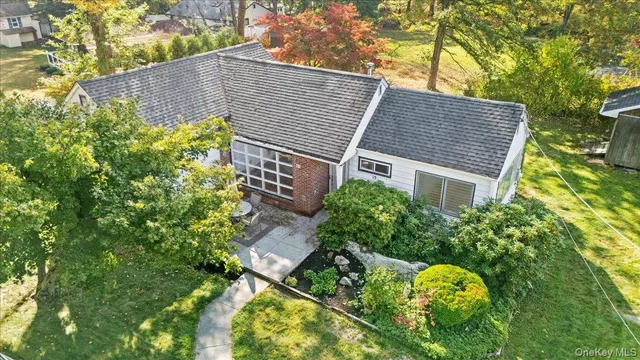 a aerial view of a house with a yard and garden