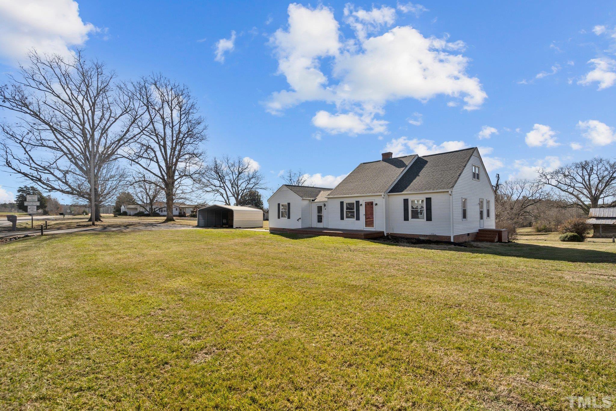 20 Dennys Store Road Roxboro, NC 27574 - Photo 1 of 46 a front view of house with yard and swimming pool