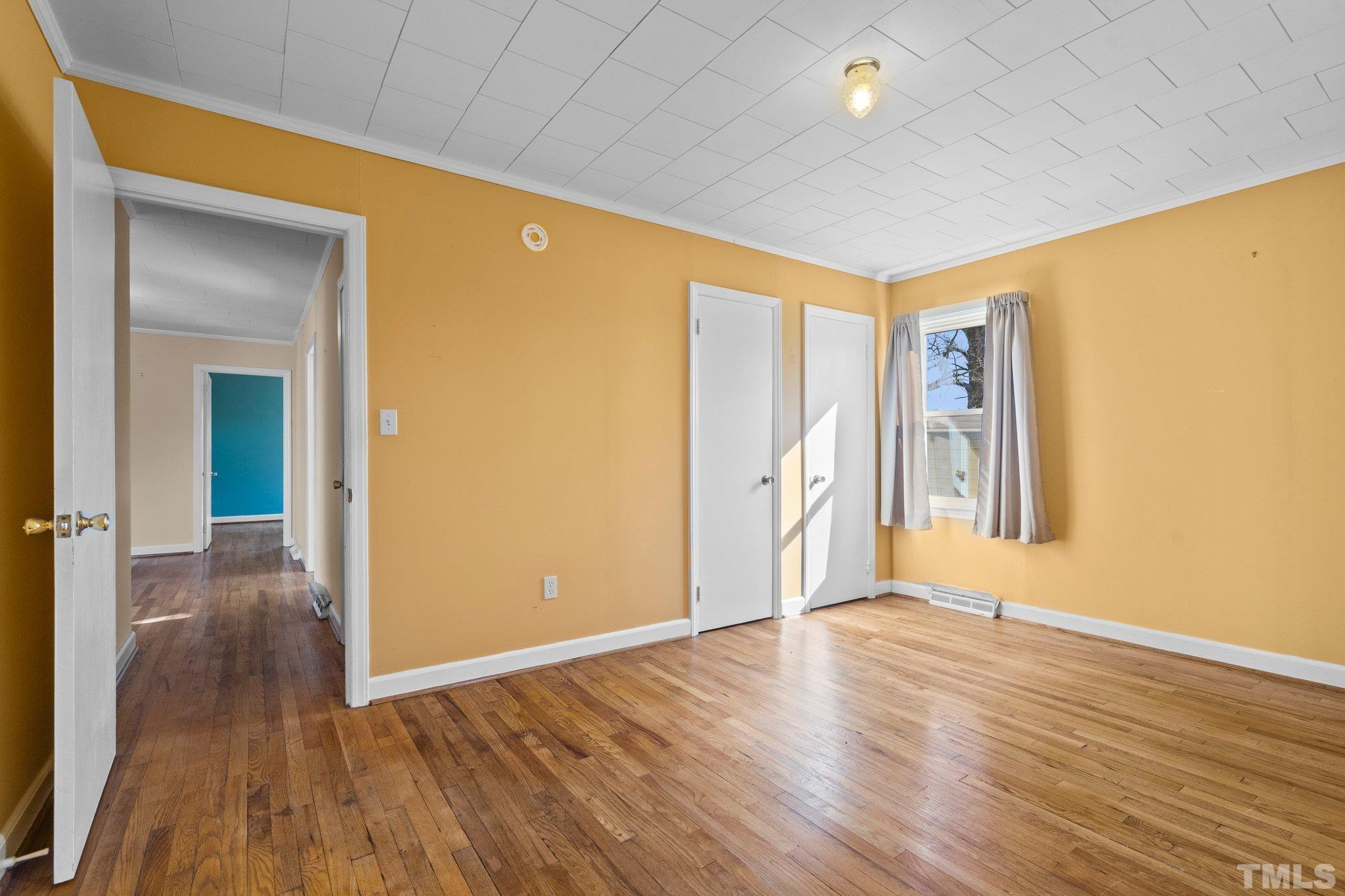 20 Dennys Store Road Roxboro, NC 27574 - Photo 15 of 46 a view of an empty room with wooden floor and a window