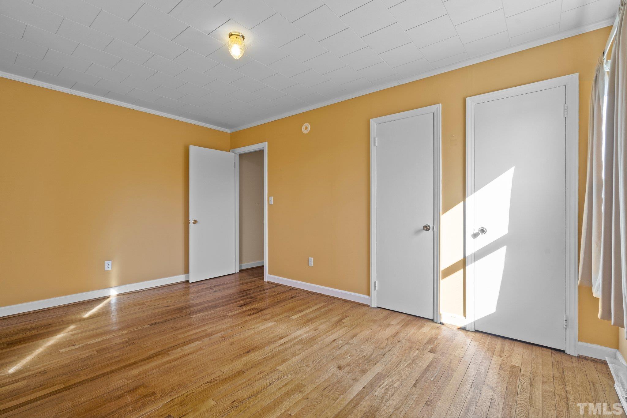 20 Dennys Store Road Roxboro, NC 27574 - Photo 16 of 46 a view of an empty room with wooden floor and a window