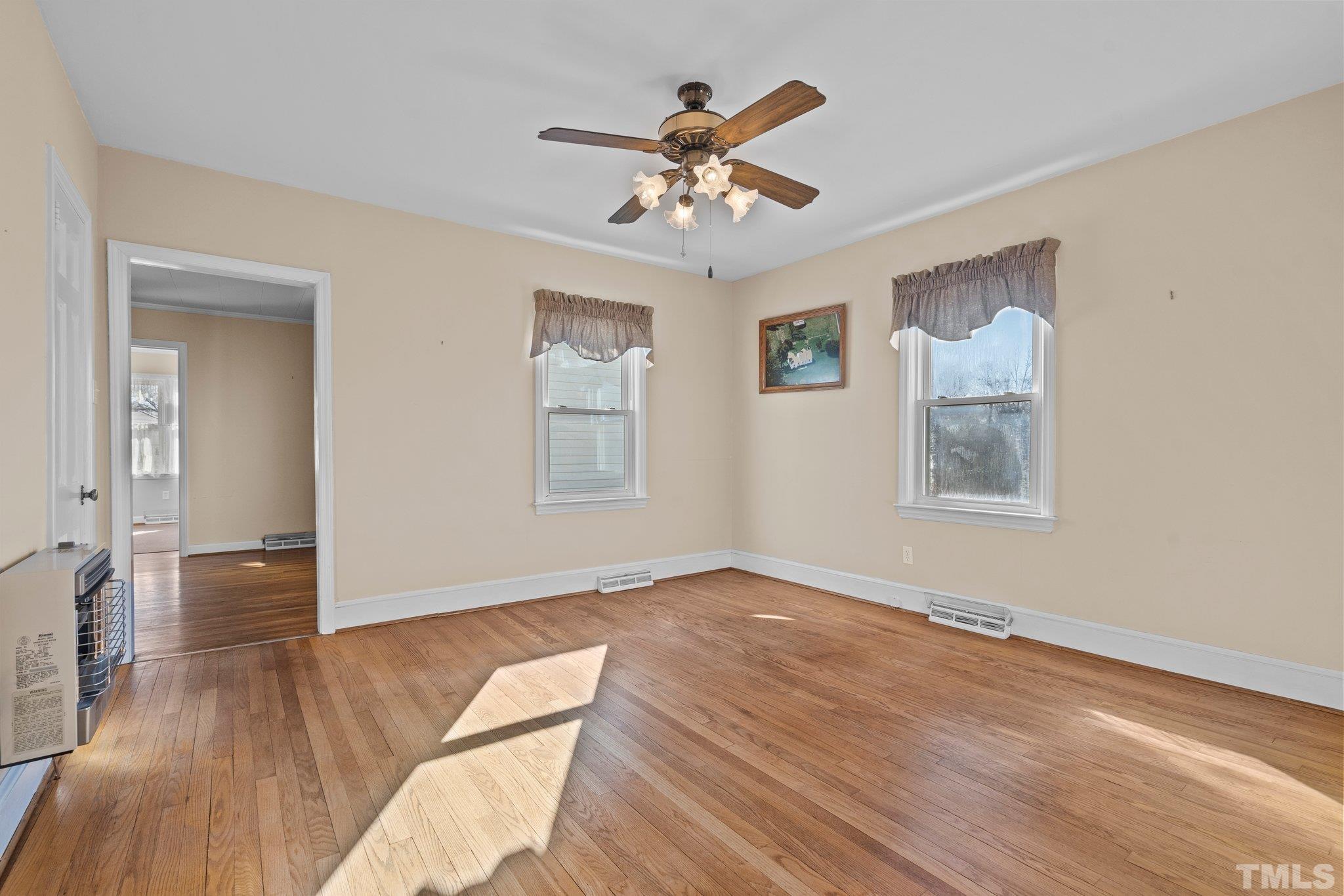 20 Dennys Store Road Roxboro, NC 27574 - Photo 19 of 46 wooden floor in an empty room with a window
