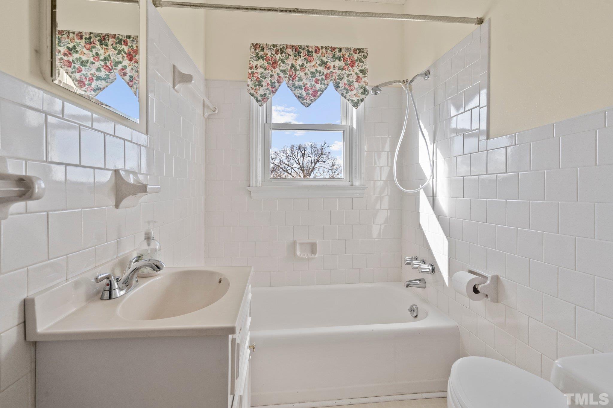 20 Dennys Store Road Roxboro, NC 27574 - Photo 20 of 46 a bathroom with a sink and a bathtub