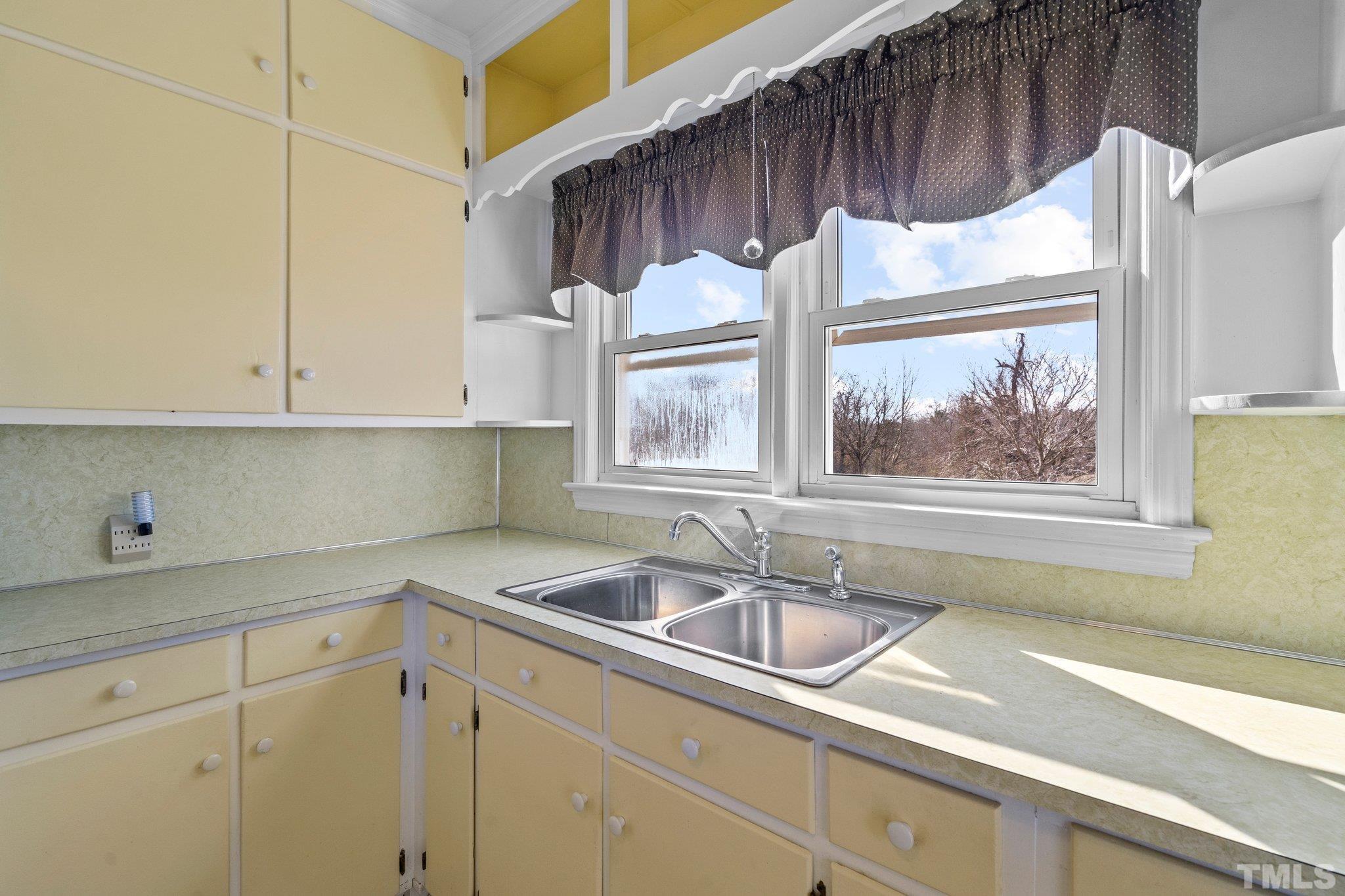 20 Dennys Store Road Roxboro, NC 27574 - Photo 23 of 46 a kitchen with a sink and a window