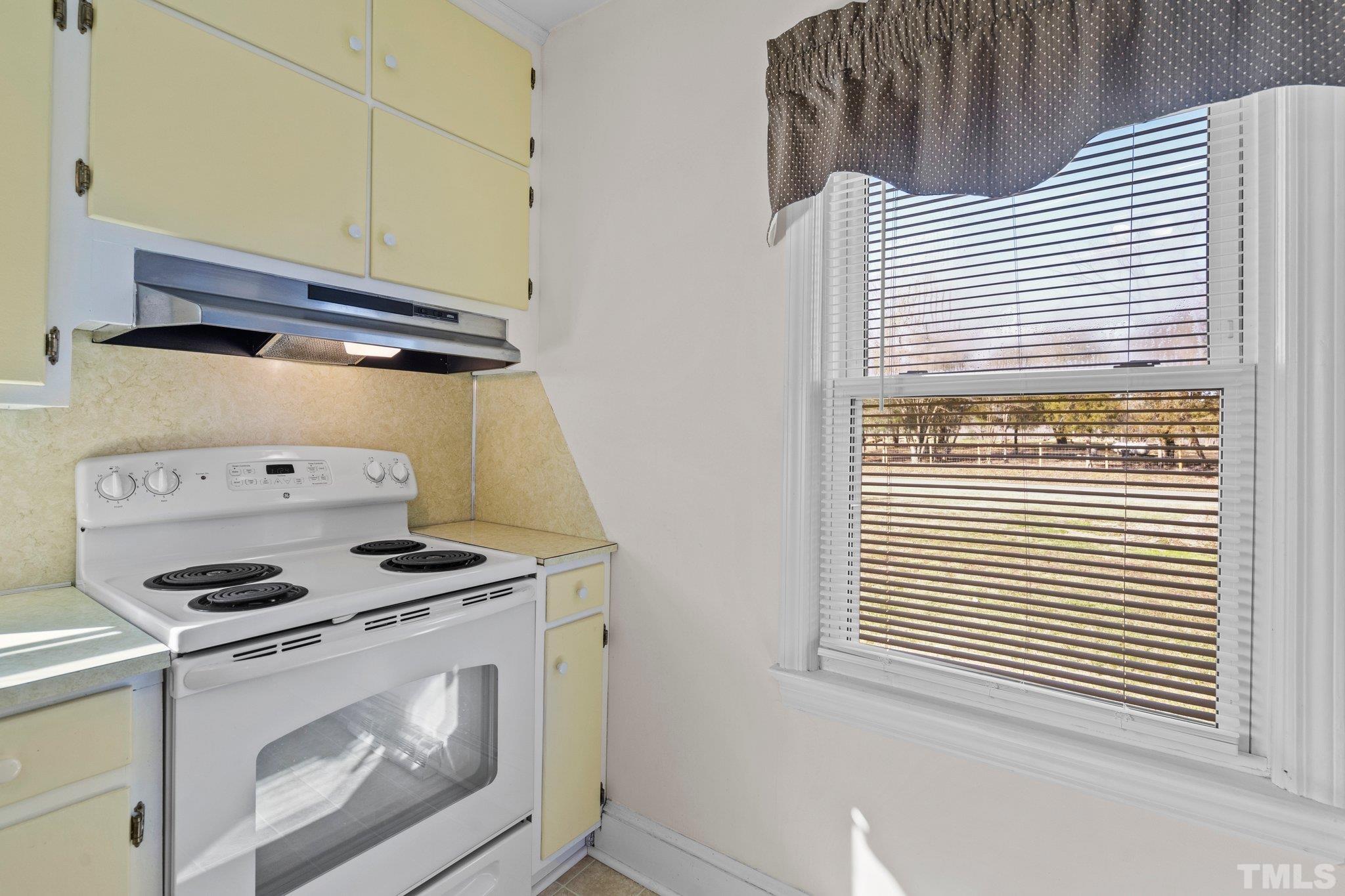 20 Dennys Store Road Roxboro, NC 27574 - Photo 24 of 46 a kitchen with a stove and a microwave