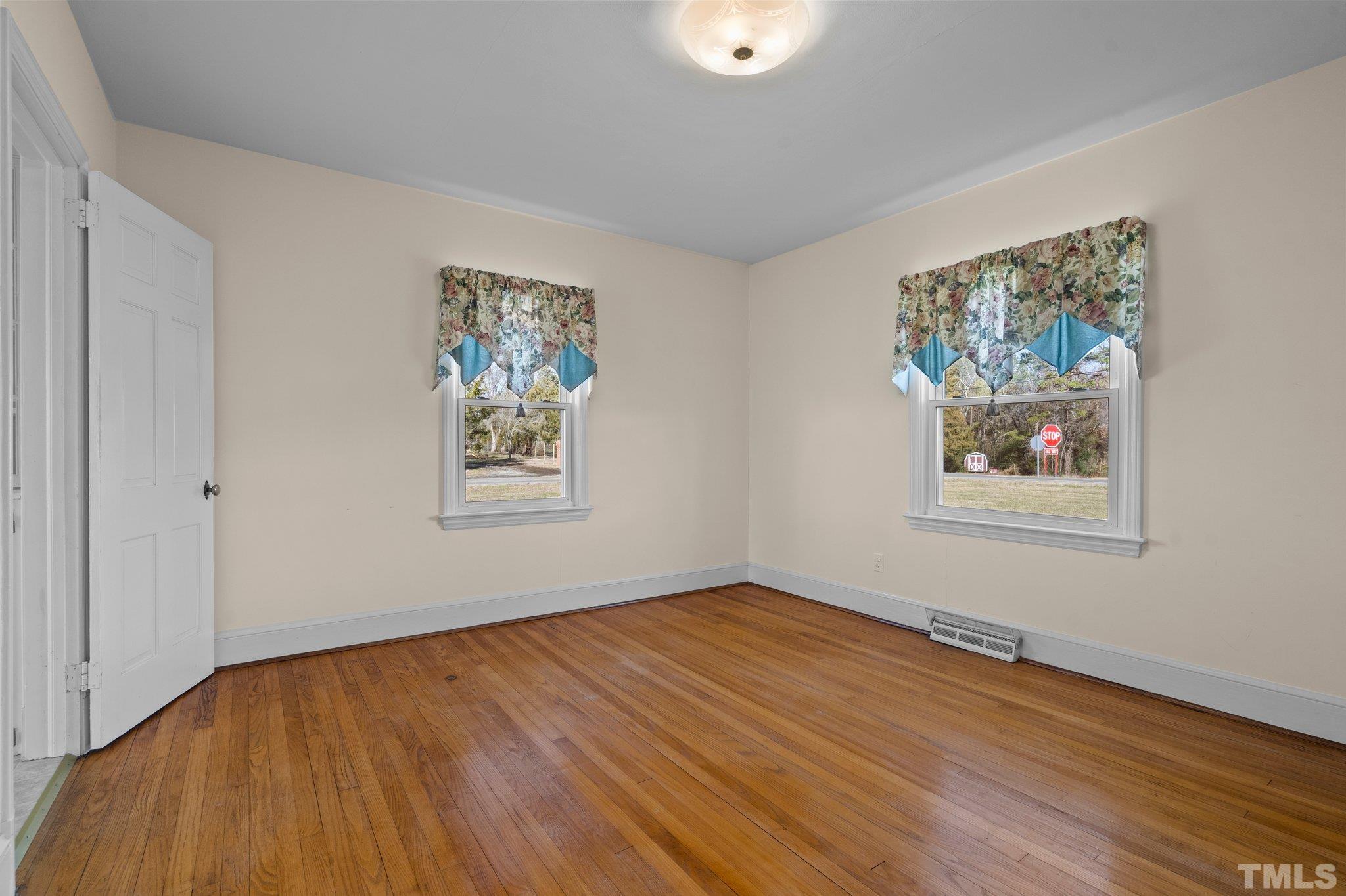20 Dennys Store Road Roxboro, NC 27574 - Photo 27 of 46 a view of a room with wooden floor and window