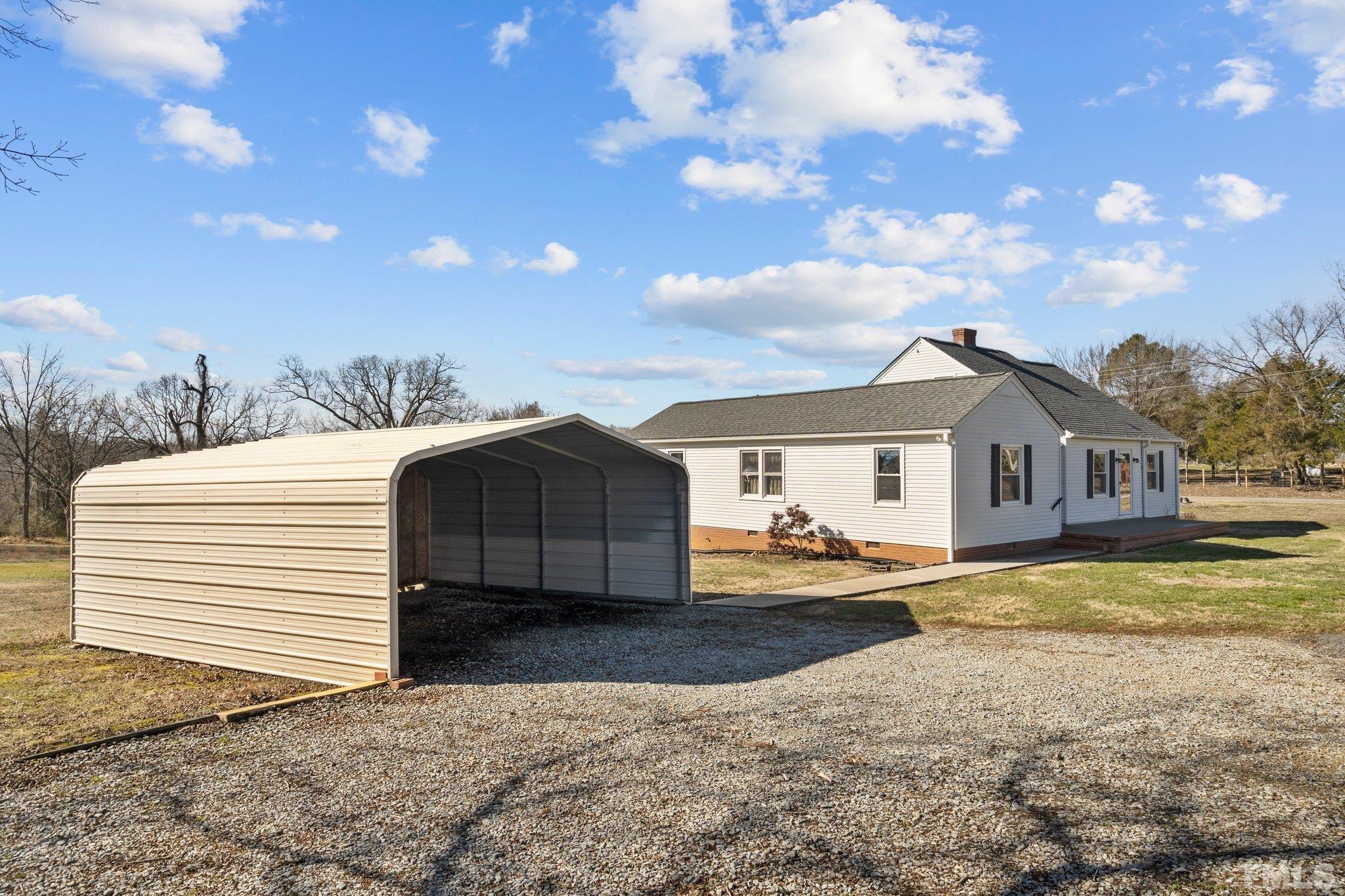 20 Dennys Store Road Roxboro, NC 27574 - Photo 3 of 46 a view of a house with a yard