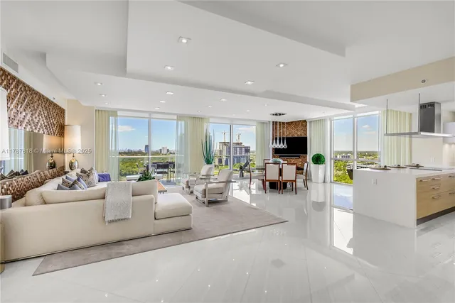 a living room with furniture flat screen tv and a fireplace